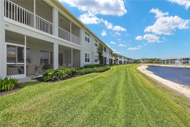 2647 Seychelles Cir Unit 2203, Naples, FL 34112 - view of community featuring a lawn, a water view, and a residential view