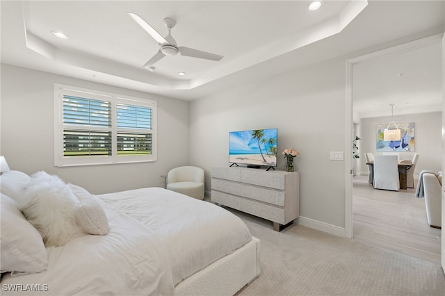 2647 Seychelles Cir Unit 2203, Naples, FL 34112 - bedroom featuring a tray ceiling, recessed lighting, baseboards, and a ceiling fan