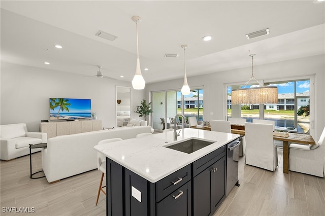 2647 Seychelles Cir Unit 2203, Naples, FL 34112 - kitchen featuring a sink, open floor plan, recessed lighting, plenty of natural light, and decorative light fixtures