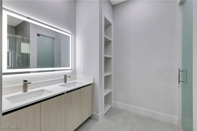 3366 72nd Ave NE, Naples, FL 34120 - full bath featuring a shower stall, double vanity, baseboards, and a walk in closet