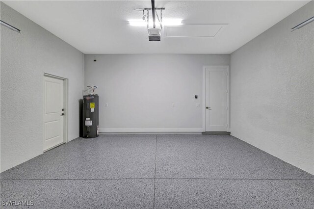 3366 72nd Ave NE, Naples, FL 34120 - garage with electric water heater, a textured wall, and a garage door opener