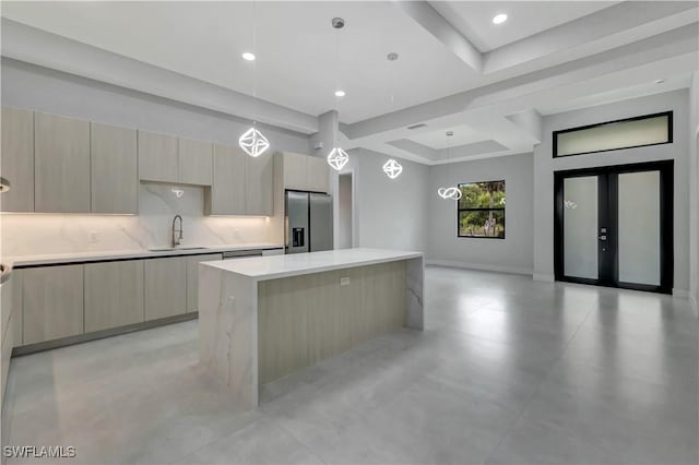 3366 72nd Ave NE, Naples, FL 34120 - kitchen with stainless steel fridge with ice dispenser, modern cabinets, a center island, light countertops, and recessed lighting