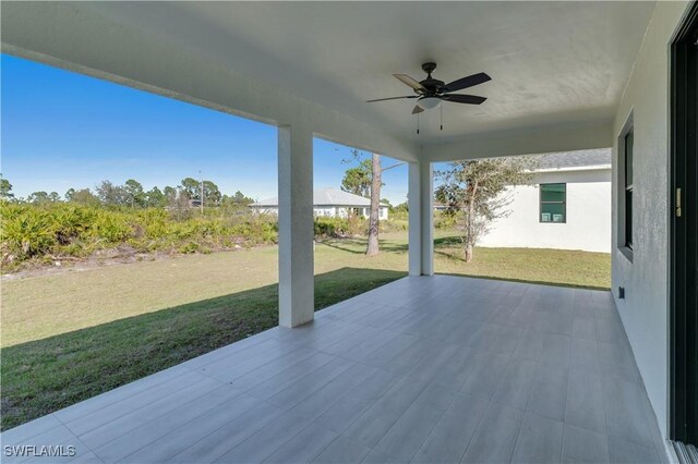 1005 State Ave, Lehigh Acres, FL 33972 - view of patio featuring ceiling fan
