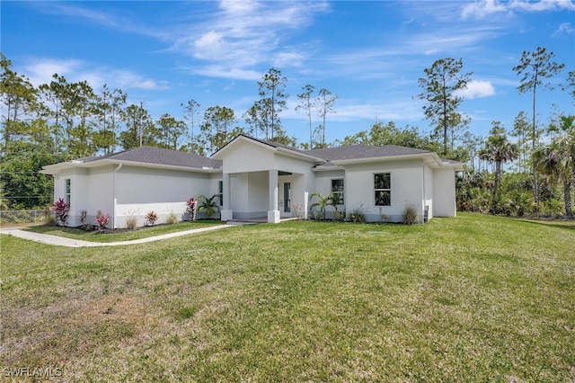 3390 12th Ave SE, Naples, FL 34117 - single story home featuring stucco siding and a front yard