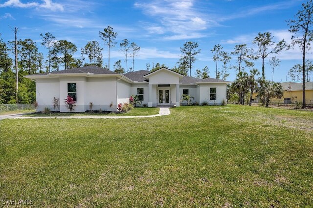 3390 12th Ave SE, Naples, FL 34117 - ranch-style home featuring french doors, stucco siding, and roof with shingles