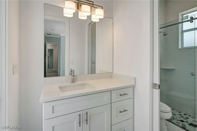 3390 12th Ave SE, Naples, FL 34117 - full bath featuring a stall shower, toilet, and vanity