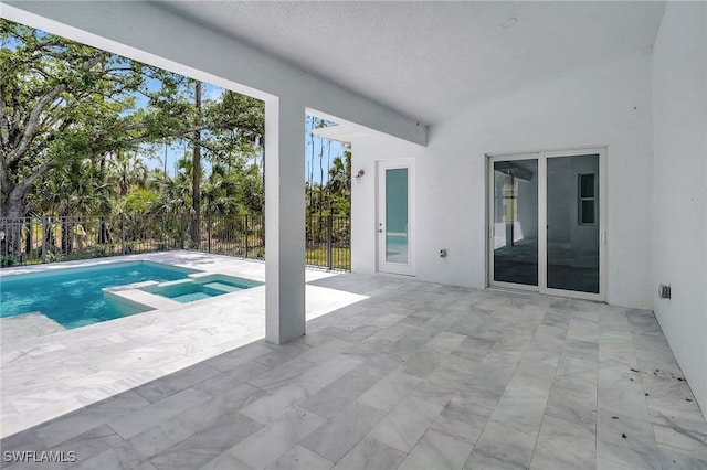 3390 12th Ave SE, Naples, FL 34117 - view of swimming pool with a patio area, fence, and a pool with connected hot tub