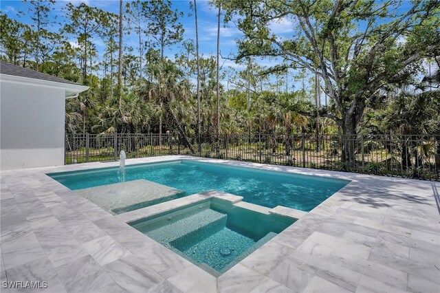 3390 12th Ave SE, Naples, FL 34117 - view of pool with fence, a pool with connected hot tub, and a patio