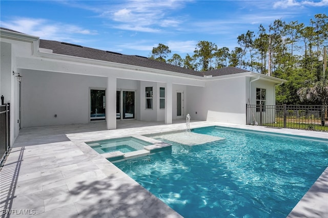 3390 12th Ave SE, Naples, FL 34117 - view of pool featuring a patio, fence, and a pool with connected hot tub