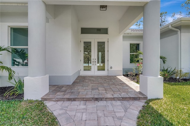 3390 12th Ave SE, Naples, FL 34117 - view of exterior entry featuring french doors and stucco siding
