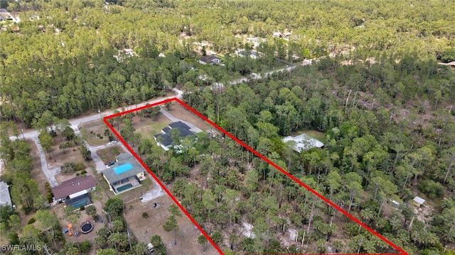 3390 12th Ave SE, Naples, FL 34117 - aerial view of property's location with a heavily wooded area and property parcel outlined