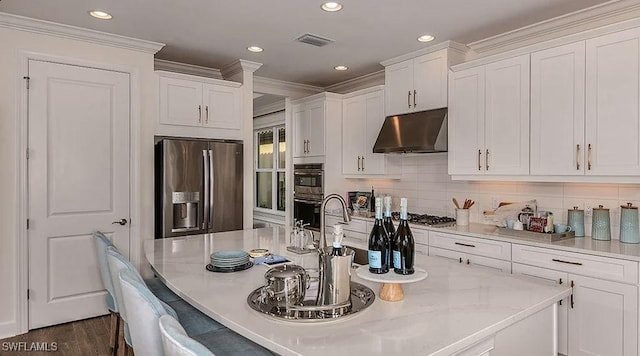 kitchen with stainless steel appliances, under cabinet range hood, white cabinetry, crown molding, and backsplash