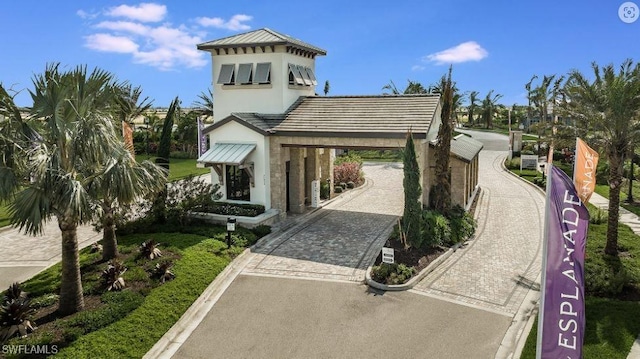 view of community with curved driveway