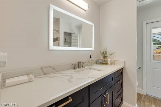 914 Albert Ave, Lehigh Acres, FL 33971 - bathroom with vanity and wood finished floors