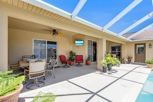 914 Albert Ave, Lehigh Acres, FL 33971 - view of patio featuring ceiling fan and outdoor dining space