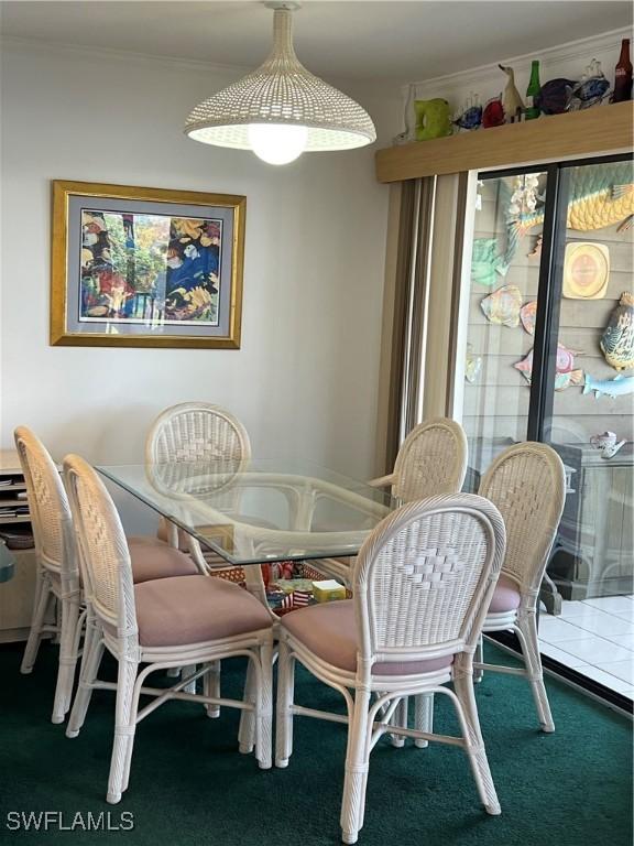 7731 Bocilla Ln Unit 9, Bokeelia, FL 33922 - dining room with crown molding