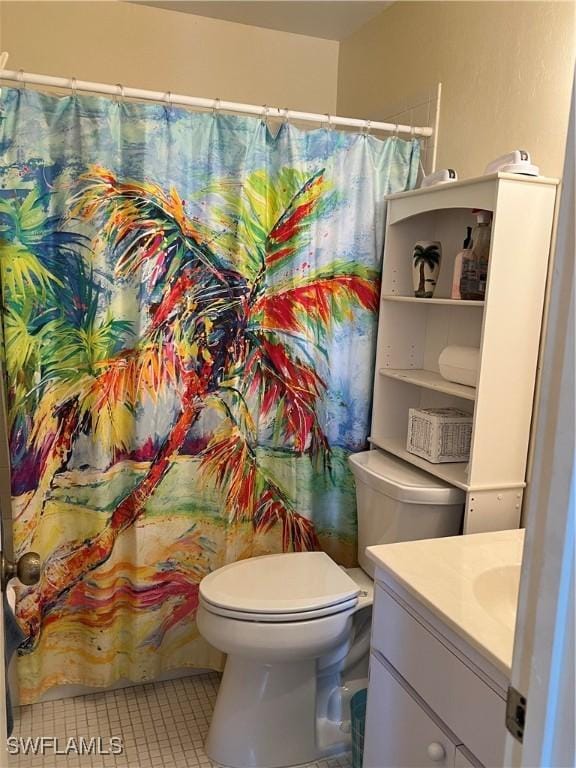 7731 Bocilla Ln Unit 9, Bokeelia, FL 33922 - bathroom featuring tile patterned flooring, toilet, vanity, and curtained shower