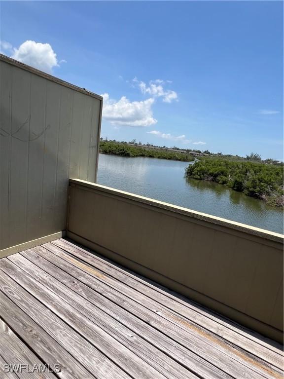 7731 Bocilla Ln Unit 9, Bokeelia, FL 33922 - wooden terrace featuring a water view