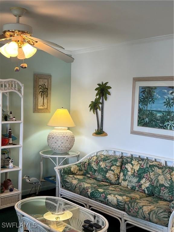 7731 Bocilla Ln Unit 9, Bokeelia, FL 33922 - living area featuring ornamental molding and a ceiling fan