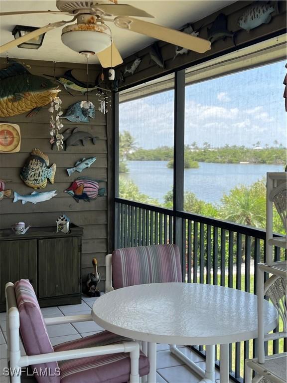 7731 Bocilla Ln Unit 9, Bokeelia, FL 33922 - sunroom featuring a water view