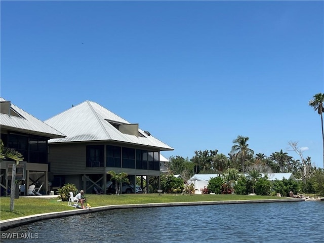 7731 Bocilla Ln Unit 9, Bokeelia, FL 33922 - view of swimming pool featuring a sunroom and a water view