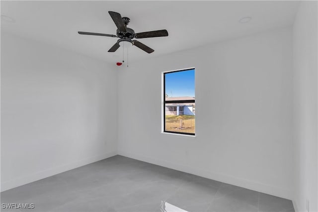 3604 Flora Ave N, Lehigh Acres, FL 33971 - unfurnished room with baseboards and ceiling fan