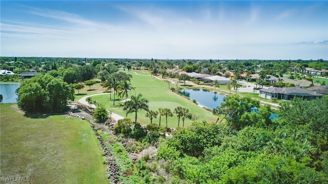 aerial view of property and surrounding area with nearby suburban area, a nearby body of water, and a golf club