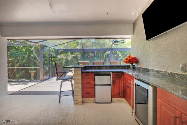 120 Heritage Way, Naples, FL 34110 - bar area featuring beverage cooler, fridge, a textured wall, and light flooring
