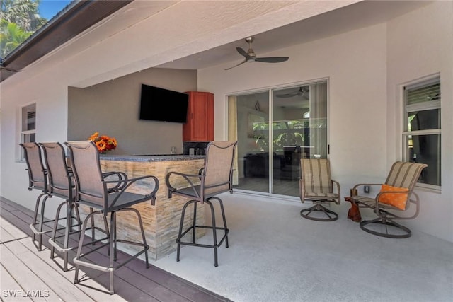 120 Heritage Way, Naples, FL 34110 - deck featuring a ceiling fan