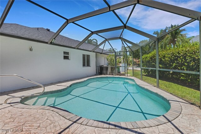120 Heritage Way, Naples, FL 34110 - outdoor pool with a patio area and glass enclosure