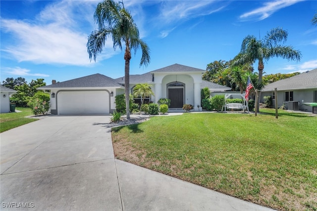 120 Heritage Way, Naples, FL 34110 - view of front of house featuring driveway, an attached garage, stucco siding, and a front lawn