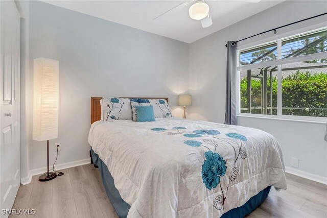 120 Heritage Way, Naples, FL 34110 - bedroom with wood finished floors, baseboards, and a ceiling fan