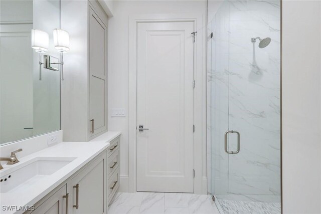541 Whispering Pine Ct, Naples, FL 34103 - full bath with a marble finish shower, vanity, and marble look tiles