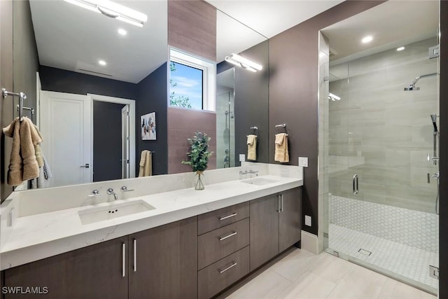 541 Whispering Pine Ct, Naples, FL 34103 - bathroom with double vanity, a stall shower, recessed lighting, and tile patterned flooring