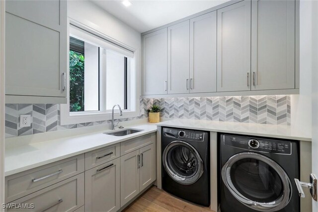 541 Whispering Pine Ct, Naples, FL 34103 - laundry room with washer and dryer and cabinet space