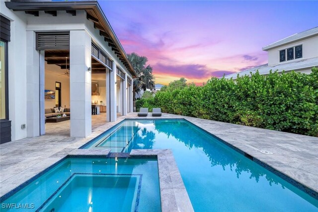541 Whispering Pine Ct, Naples, FL 34103 - view of swimming pool with a patio and a pool with connected hot tub