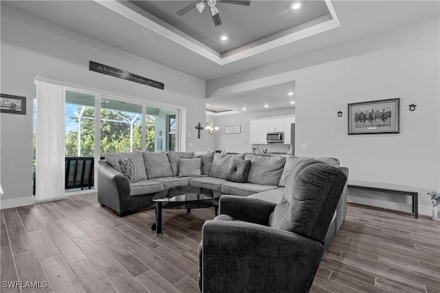 1806 SW 17th St, Cape Coral, FL 33991 - living area featuring ceiling fan, wood finished floors, a chandelier, recessed lighting, and a raised ceiling