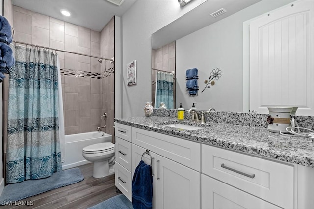 1806 SW 17th St, Cape Coral, FL 33991 - full bath featuring wood finished floors, toilet, shower / bathtub combination with curtain, and vanity