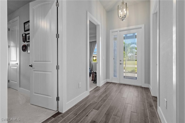 1806 SW 17th St, Cape Coral, FL 33991 - foyer with dark wood-style floors, baseboards, and a chandelier