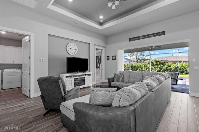 1806 SW 17th St, Cape Coral, FL 33991 - living room featuring washer / clothes dryer, wood tiled floors, ceiling fan, recessed lighting, and baseboards