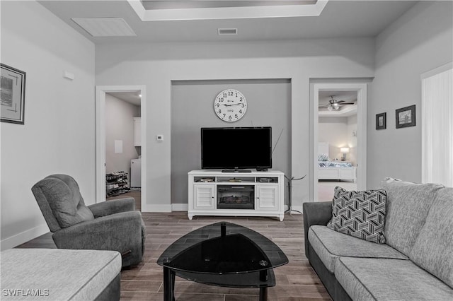 1806 SW 17th St, Cape Coral, FL 33991 - living room featuring dark wood-type flooring, a ceiling fan, and baseboards