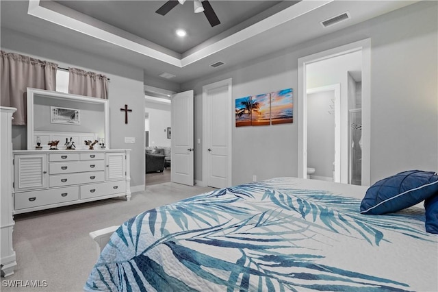 1806 SW 17th St, Cape Coral, FL 33991 - bedroom featuring light colored carpet, a raised ceiling, recessed lighting, ceiling fan, and connected bathroom
