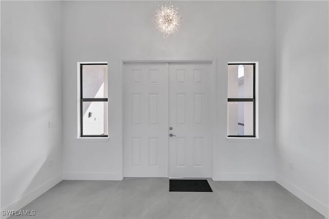 entrance foyer featuring healthy amount of natural light and baseboards