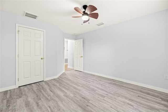 unfurnished bedroom with light wood-style flooring, baseboards, and a ceiling fan