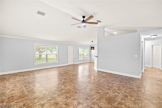 unfurnished living room featuring a ceiling fan, baseboards, vaulted ceiling, and crown molding