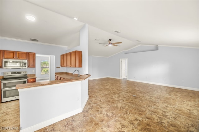 kitchen with appliances with stainless steel finishes, lofted ceiling, open floor plan, brown cabinetry, and crown molding