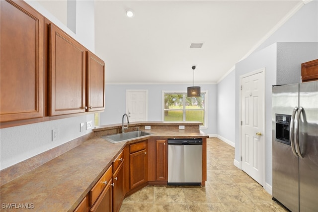 kitchen featuring stainless steel appliances, a sink, a peninsula, ornamental molding, and brown cabinets