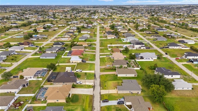 aerial view of property and surrounding area with nearby suburban area