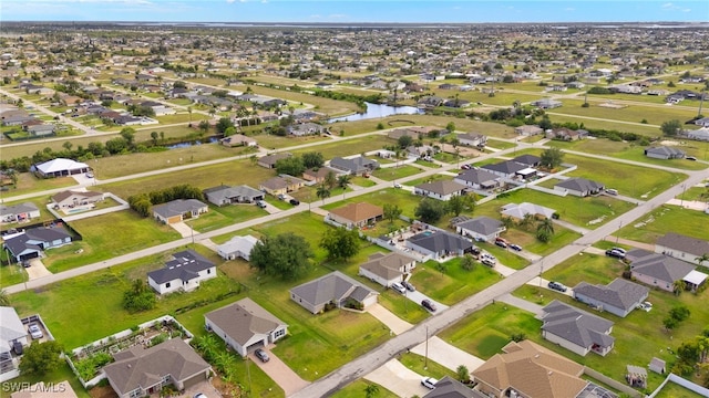 view of property location featuring nearby suburban area and a nearby body of water