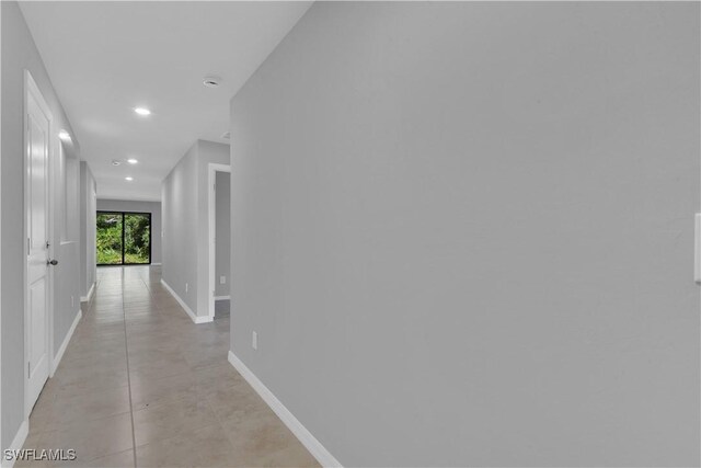 23206 Fitzpatrick Ave, Port Charlotte, FL 33980 - corridor with recessed lighting and baseboards